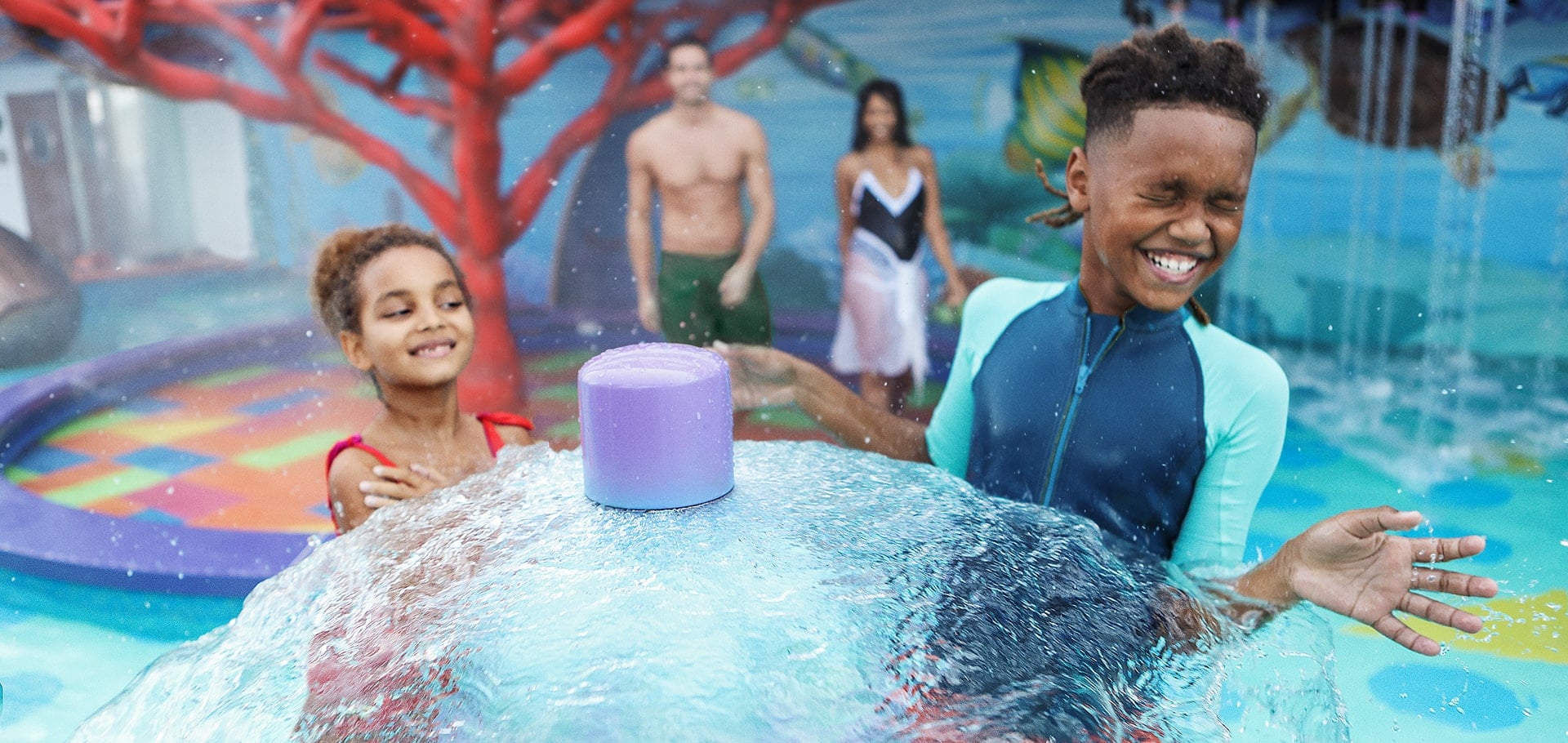 Slide down colorful waterslides and a kids splash pad at the Aquapark onboard MSC World America | MSC Cruises